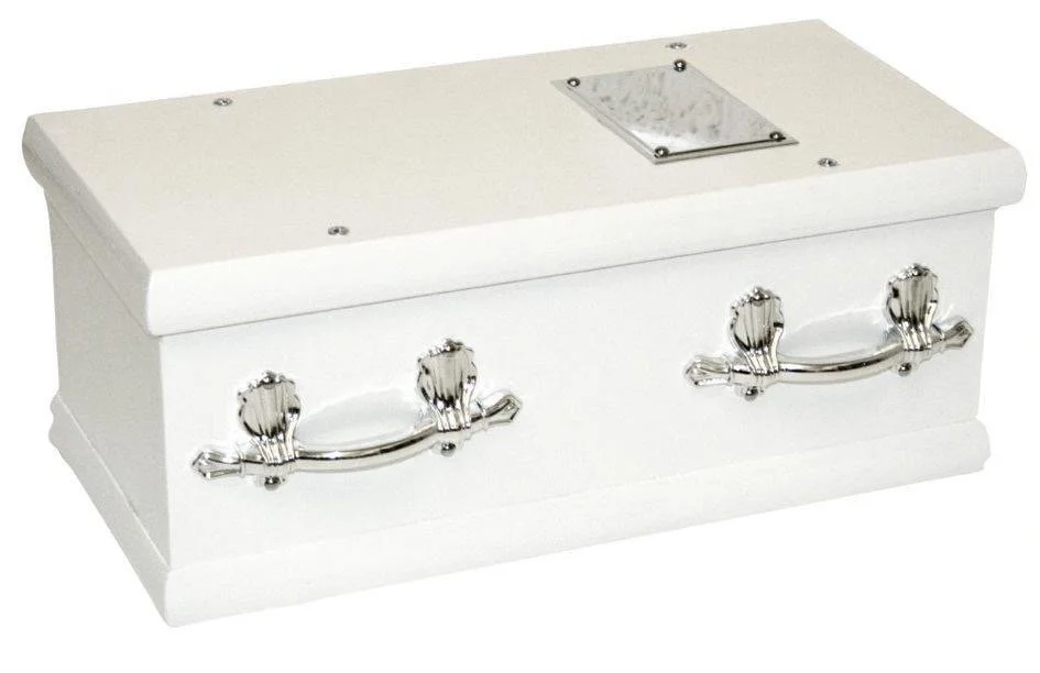 Pure white traditional funeral coffin with silver handles